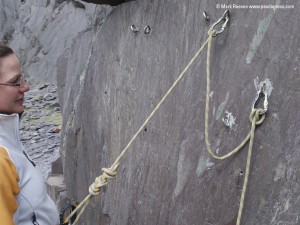 Then clove hitch the rope into the second anchor leaving some slack between the first and second anchor.